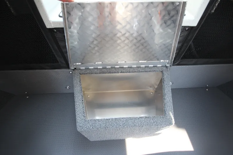 Slide: The Image of Storage compartment in 2027 Weldcraft 240 Ocean King boat, featuring a diamond plate lid. - 29