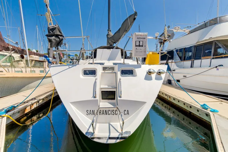 Slide: The Image of 1987 Macintosh Center Cockpit sailboat docked in San Francisco marina. - 2