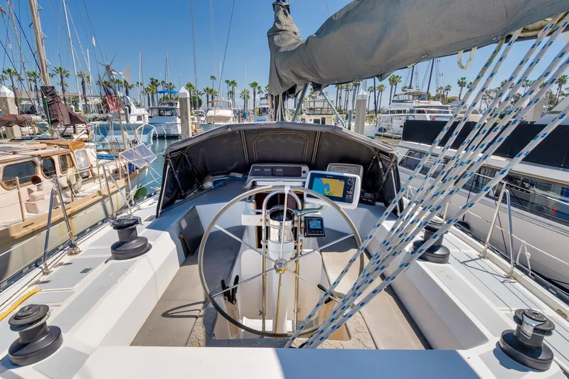 Slide: The Image of 1987 Macintosh Center Cockpit sailboat with navigation equipment, docked in a marina. - 35