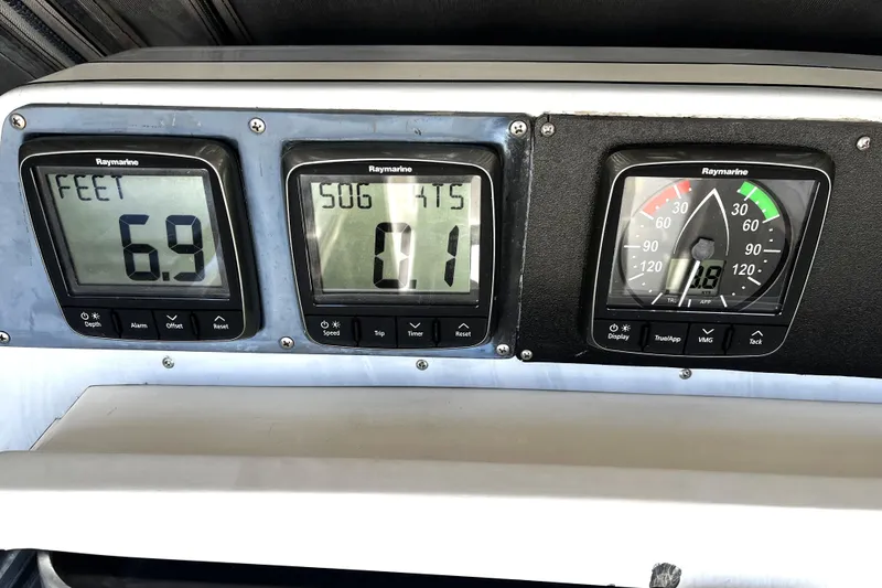 Slide: The Image of Digital navigation instruments on a 1987 Macintosh Center Cockpit boat display depth, speed, and wind angle. - 38