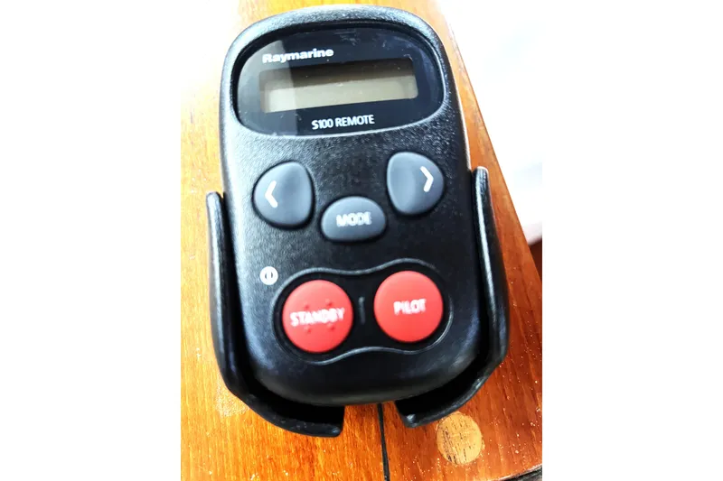 Slide: The Image of Raymarine S100 remote control on wooden surface, for 1987 Macintosh Center Cockpit. - 29