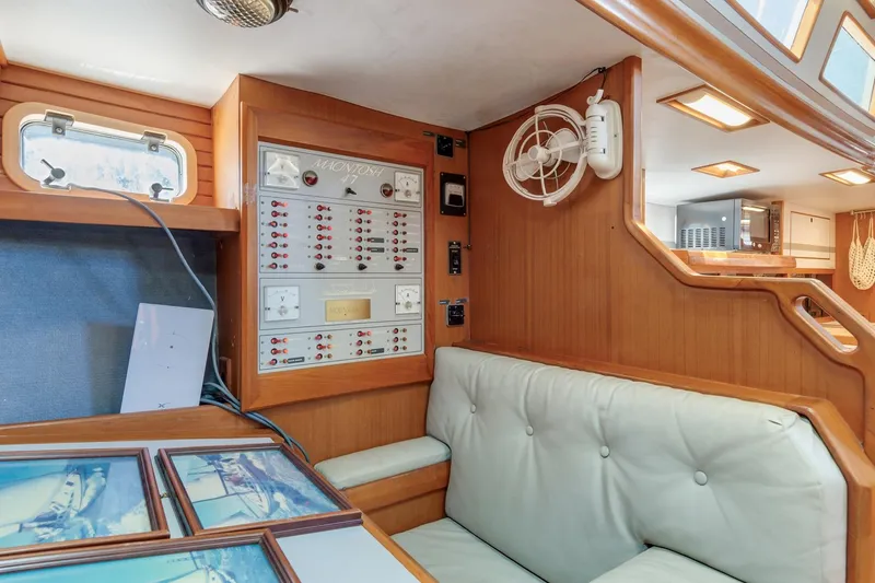 Slide: The Image of Interior of 1987 Macintosh Center Cockpit yacht with control panel and seating area. - 12