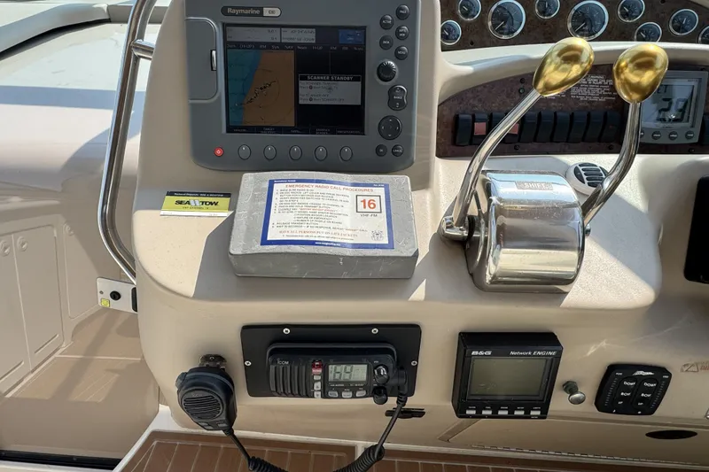 Slide: The Image of Control panel of a 2000 Sea Ray 340 Sundancer boat with navigation equipment. - 13