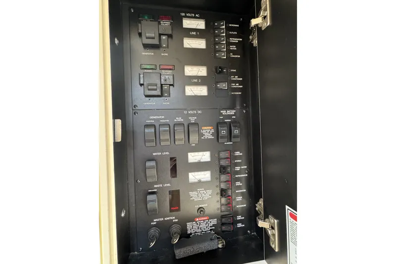 Slide: The Image of Electrical control panel on a 2000 Sea Ray 340 Sundancer boat. - 24