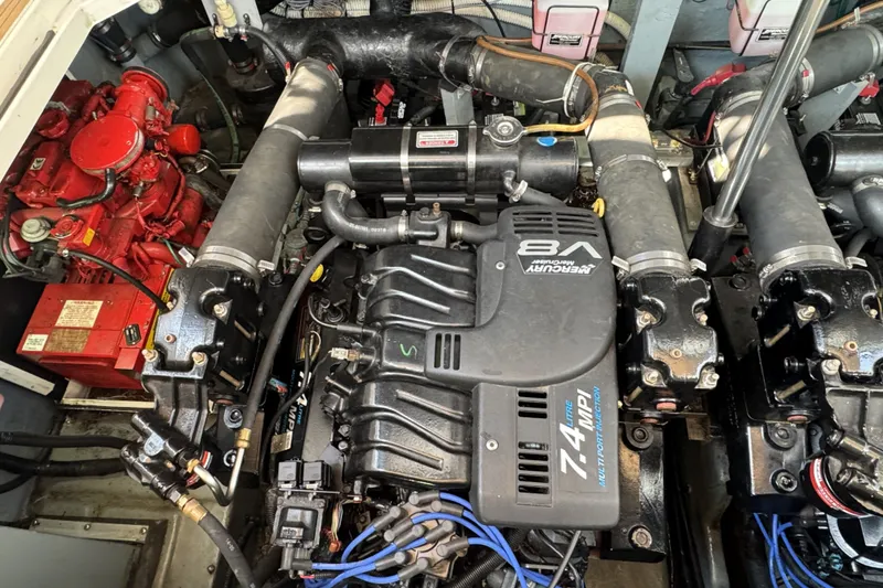 Slide: The Image of Engine compartment of a 2000 Sea Ray 340 Sundancer with Mercury V8 engine. - 27