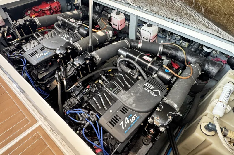 Slide: The Image of Engine compartment of a 2000 Sea Ray 340 Sundancer with twin 7.4L MPI engines. - 25