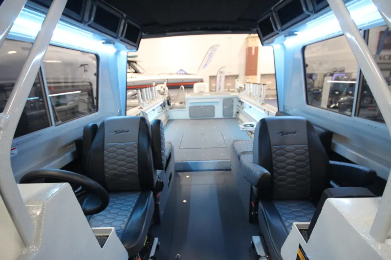Slide: The Image of Interior of 2026 Weldcraft 260 Ocean King boat, featuring modern seating and spacious layout. - 29