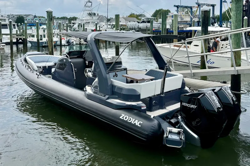 The Image of 2026 Zodiac Medline 9 boat docked at marina under cloudy sky. - 0