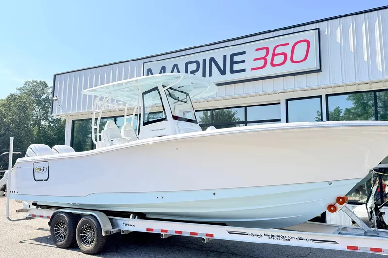 Slide: The Image of 2027 Sea Hunt Ultra 285SL boat on trailer at Marine 360 dealership. - 2