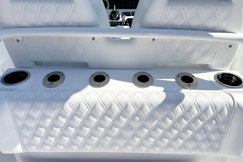 Slide: The Image of Luxurious white seating with cup holders on 2027 Sea Hunt Ultra 285SL boat. - 9