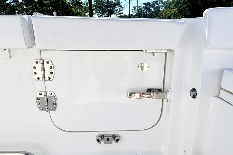 Slide: The Image of 2027 Sea Hunt Ultra 285SL boat door with stainless steel hinges and latch. - 4