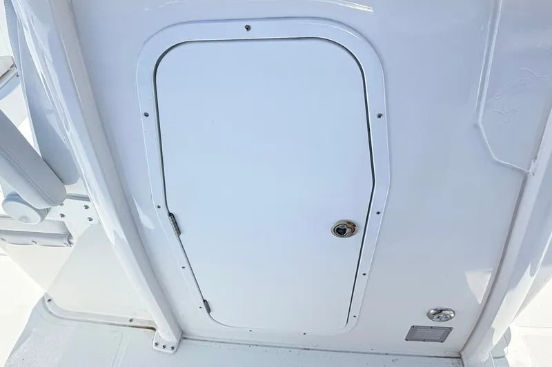 Slide: The Image of White hatch door on 2027 Sea Hunt Ultra 285SL boat interior. - 29
