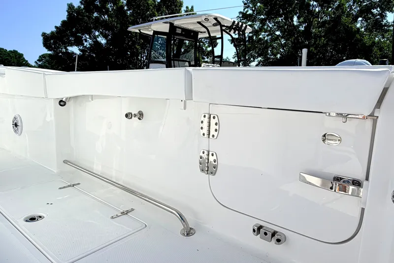 Slide: The Image of 2027 Sea Hunt Ultra 285SL boat interior with sleek white finish and stainless steel fittings. - 6