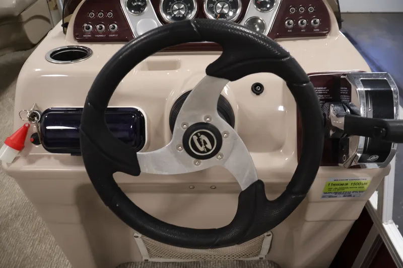 Slide: The Image of Steering console of 2011 Sylvan Mirage 8520 boat with gauges and controls. - 20