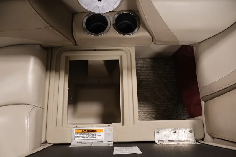 Slide: The Image of Interior storage compartment of a 2011 Sylvan Mirage 8520 boat with cup holders. - 31