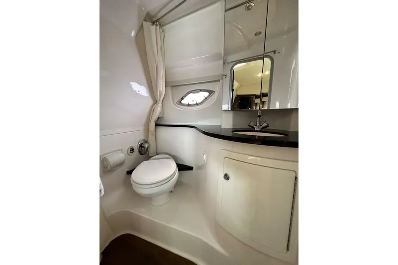 Slide: The Image of Luxurious bathroom in 2015 Regal 35 Sport Coupe yacht with modern fixtures. - 24