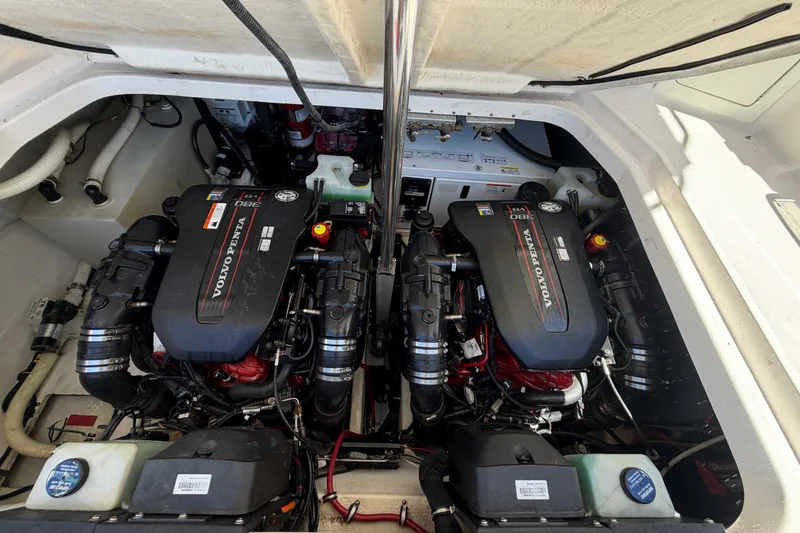 Slide: The Image of Twin Volvo Penta engines in a 2015 Regal 35 Sport Coupe boat. - 25