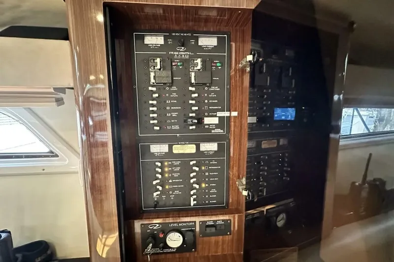 Slide: The Image of Electrical control panel inside a 2015 Regal 35 Sport Coupe yacht. - 23