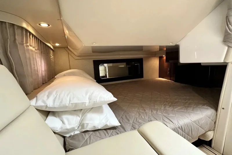 Slide: The Image of Luxurious interior cabin of 2015 Regal 35 Sport Coupe with cozy bedding. - 21