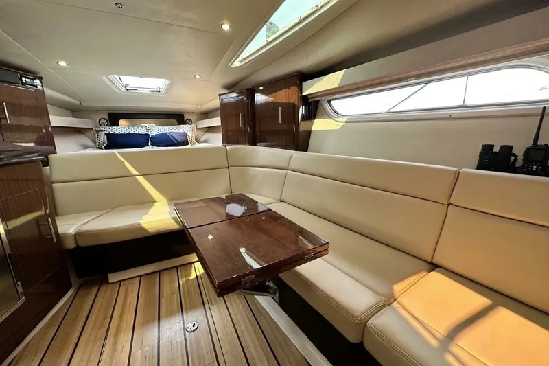 Slide: The Image of Luxurious interior of 2015 Regal 35 Sport Coupe with elegant seating and wooden accents. - 22