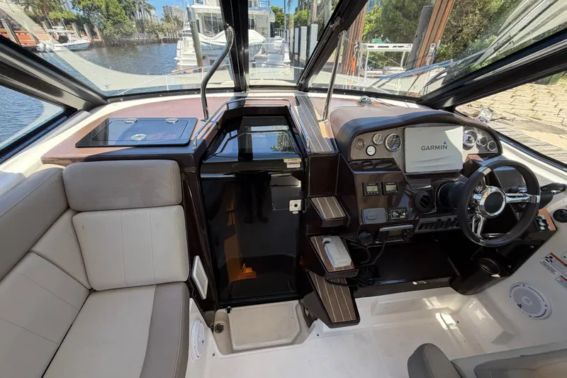 Slide: The Image of Interior of a 2015 Regal 35 Sport Coupe boat with Garmin navigation system. - 16