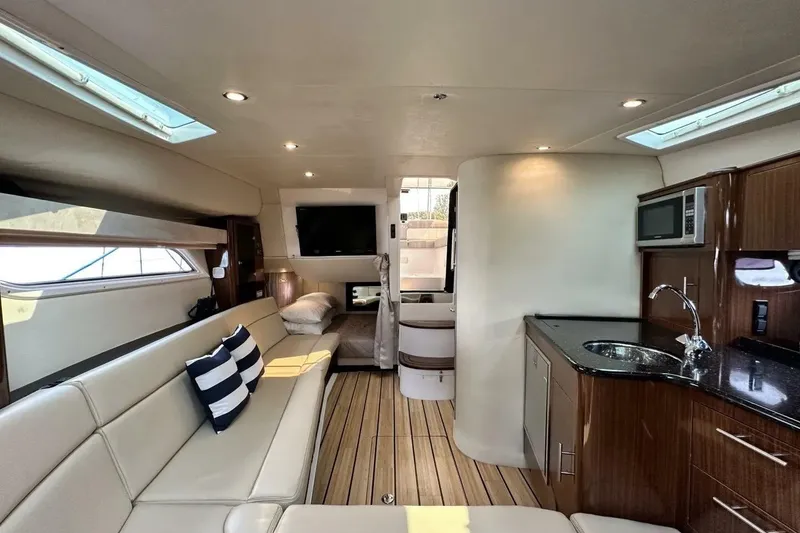 Slide: The Image of Luxurious interior of 2015 Regal 35 Sport Coupe yacht with modern amenities and elegant design. - 20
