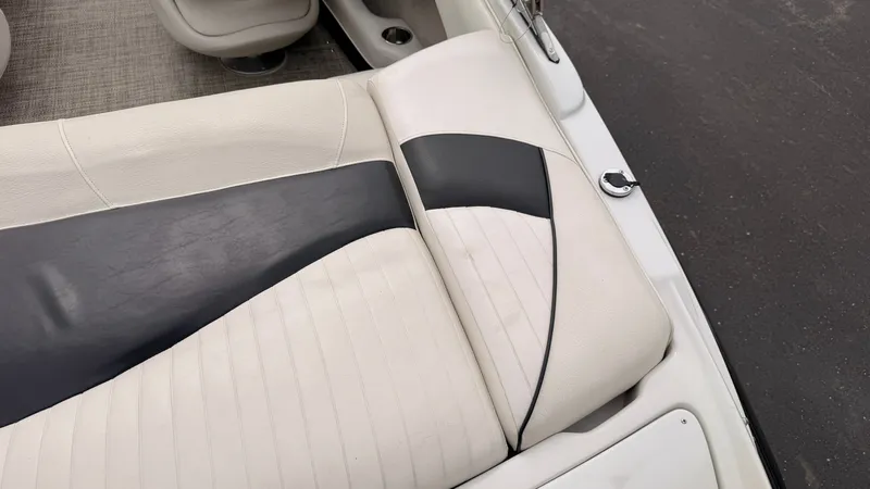 Slide: The Image of Close-up of a white and black boat seat with a quilted design. - 17