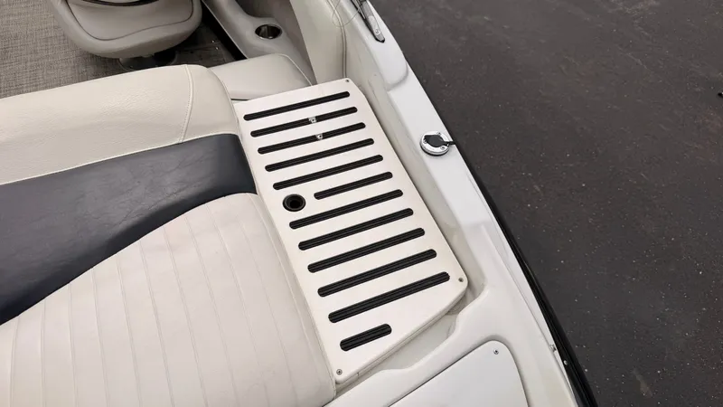 Slide: The Image of Close-up of a 2009 Crownline 185 SS boat's seating area with striped design. - 18