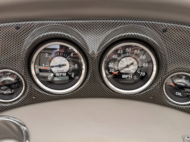 Slide: The Image of Dashboard of a 2009 Crownline 185 SS boat with speedometer and tachometer. - 36