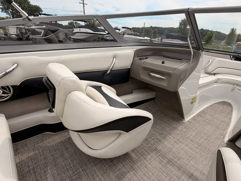 Slide: The Image of Interior of a 2009 Crownline 185 SS boat with white and black seating. - 27