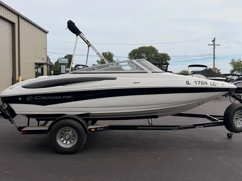 Slide: The Image of 2009 Crownline 185 SS on a trailer, parked in a lot. - 6