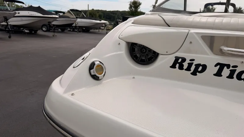 Slide: The Image of The image shows the stern of a 2009 Crownline 185 SS boat named "Rip Tide." - 14