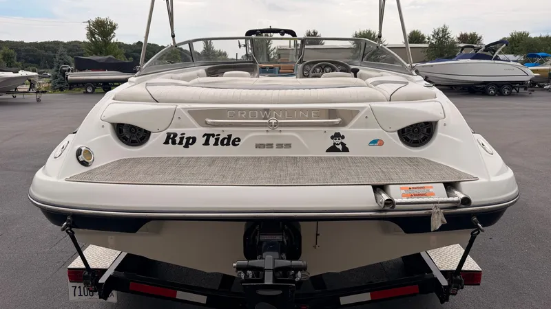 Slide: The Image of Rear view of a 2009 Crownline 185 SS boat on a trailer. - 10