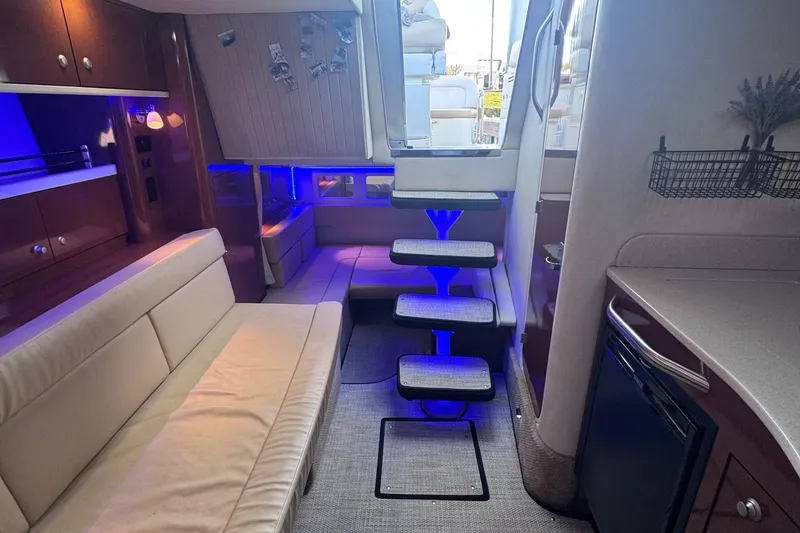 Slide: The Image of Interior of 2008 Sea Ray 350 Sundancer yacht with modern seating and ambient lighting. - 37