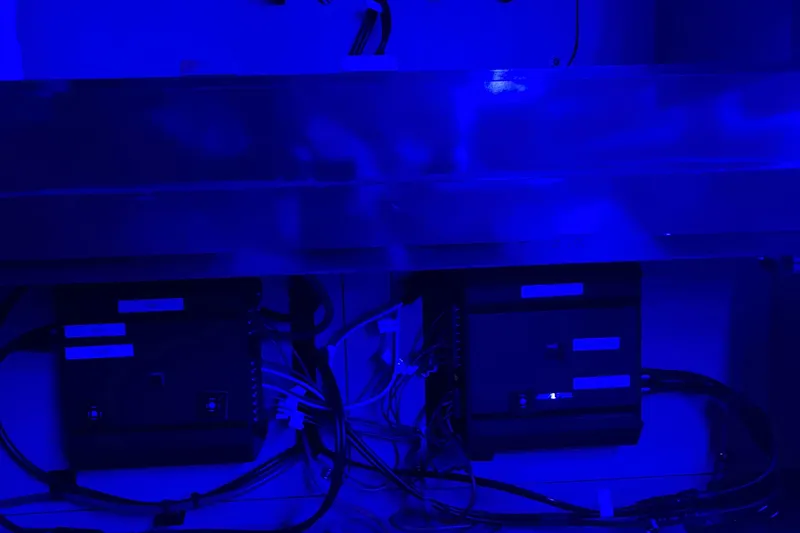 Slide: The Image of Electrical components in blue-lit compartment of 2008 Sea Ray 350 Sundancer boat. - 47