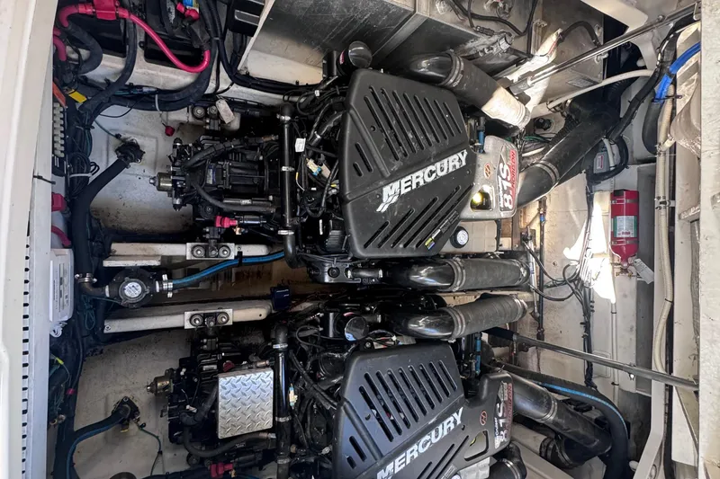 Slide: The Image of Engine compartment of a 2008 Sea Ray 350 Sundancer with twin Mercury engines. - 54