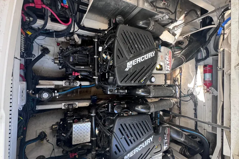Slide: The Image of Engine compartment of a 2008 Sea Ray 350 Sundancer with twin Mercury engines. - 55