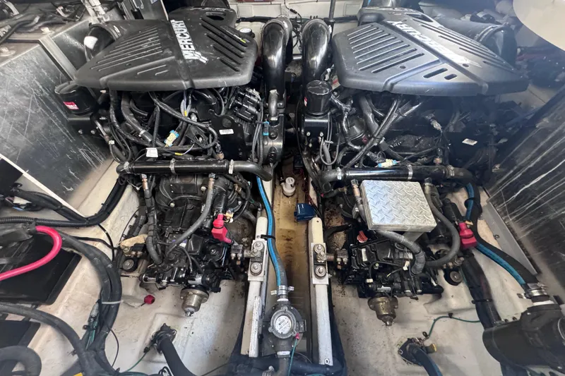 Slide: The Image of Twin engines in a 2008 Sea Ray 350 Sundancer boat engine room. - 56