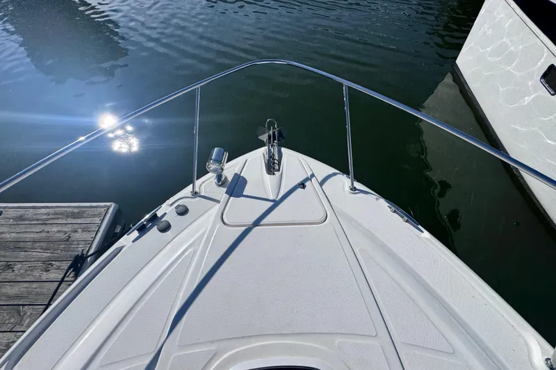 Slide: The Image of Bow view of 2008 Sea Ray 350 Sundancer docked on calm water. - 14