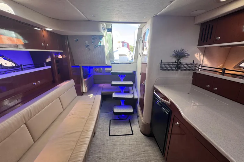 Slide: The Image of Luxurious interior of 2008 Sea Ray 350 Sundancer yacht with modern seating and ambient lighting. - 35