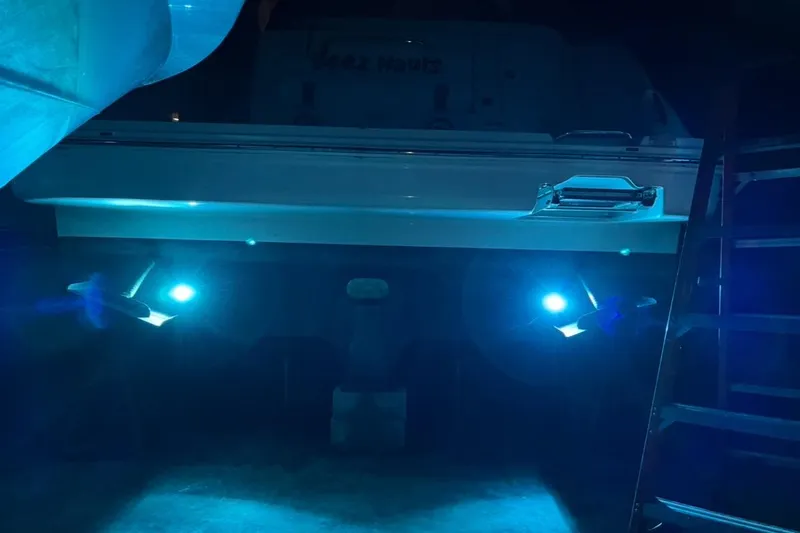 Slide: The Image of 2008 Sea Ray 350 Sundancer with illuminated underwater lights at night. - 53