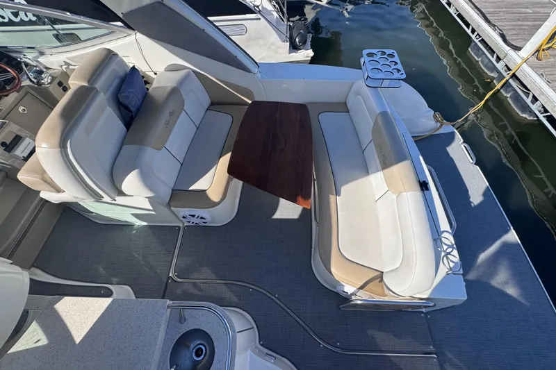 Slide: The Image of 2008 Sea Ray 350 Sundancer boat interior with seating and table, docked at marina. - 9