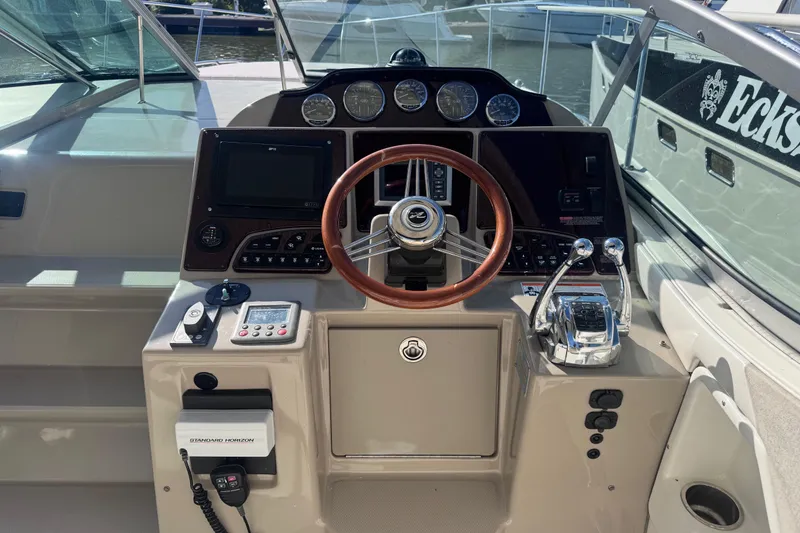 Slide: The Image of Helm of 2008 Sea Ray 350 Sundancer with steering wheel and control panel. - 20