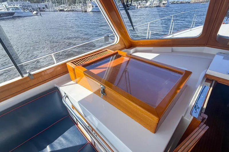 Slide: The Image of Interior of 2003 Grand Banks 38 Eastbay HX yacht with wooden details and marina view. - 9