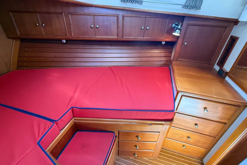 Slide: The Image of Interior cabin of 2003 Grand Banks 38 Eastbay HX with red cushions and wooden cabinetry. - 29