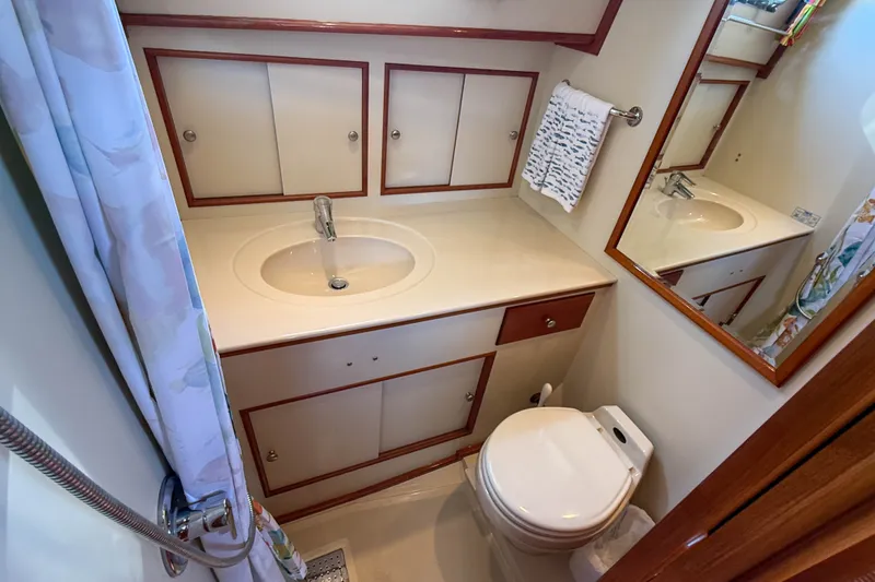 Slide: The Image of Bathroom interior of 2003 Grand Banks 38 Eastbay HX yacht, featuring sink and toilet. - 31