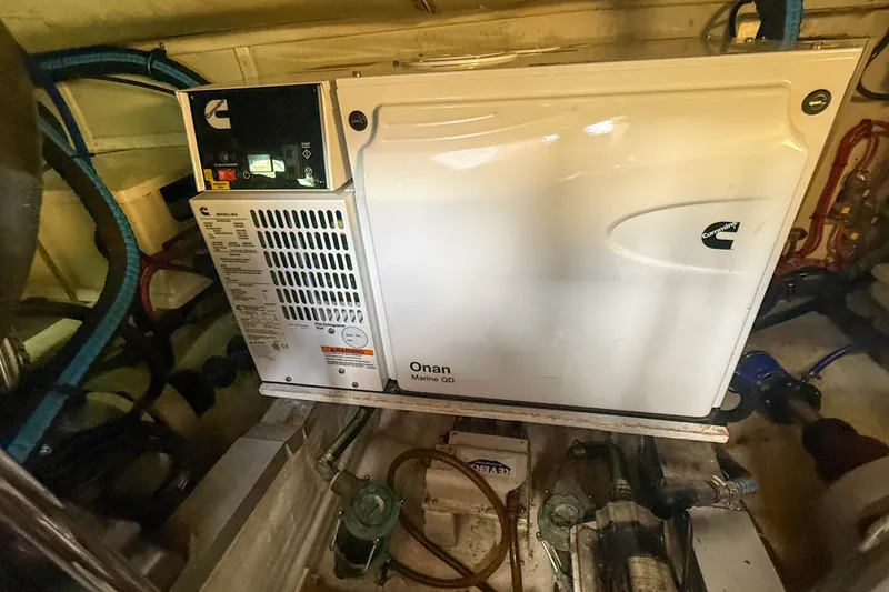 Slide: The Image of Engine room of 2003 Grand Banks 38 Eastbay HX with Cummins Onan Marine generator. - 45