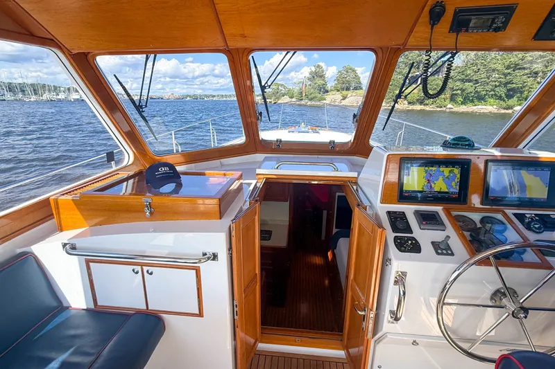 Slide: The Image of Interior view of 2003 Grand Banks 38 Eastbay HX yacht cockpit with navigation equipment. - 16
