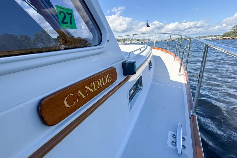 Slide: The Image of 2003 Grand Banks 38 Eastbay HX yacht "Candide" cruising on a sunny day. - 38