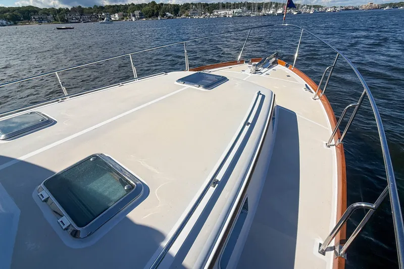 Slide: The Image of 2003 Grand Banks 38 Eastbay HX yacht deck with scenic waterfront view. - 39